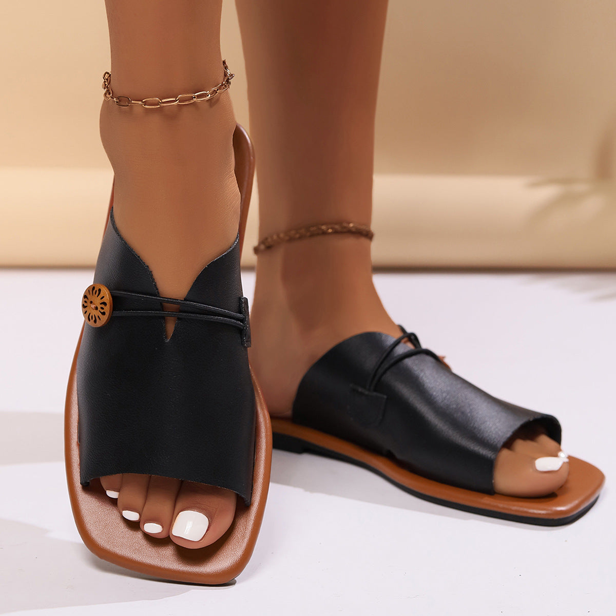 Elegant Open-Toe Slip-On Sandals with Decorative Button Detail